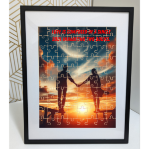 Jigsaw puzzle depicting two silhouettes holding hands against a vibrant sunset, symbolizing unity with the quote ‘Love is composed of a single soul inhabiting two bodies.’