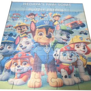 A completed custom wooden jigsaw puzzle featuring characters from the animated series Paw Patrol, with a focus on the central character, a brown and white police pup.